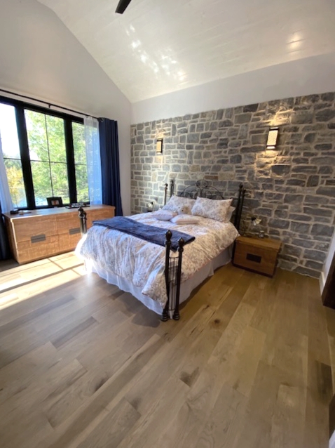 Bedroom with hardwood flooring